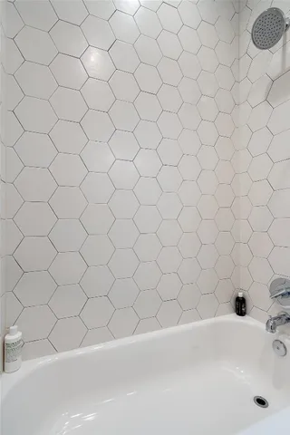 a view of a hallway with washer and dryer