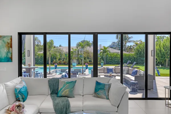 a living room with furniture and large window