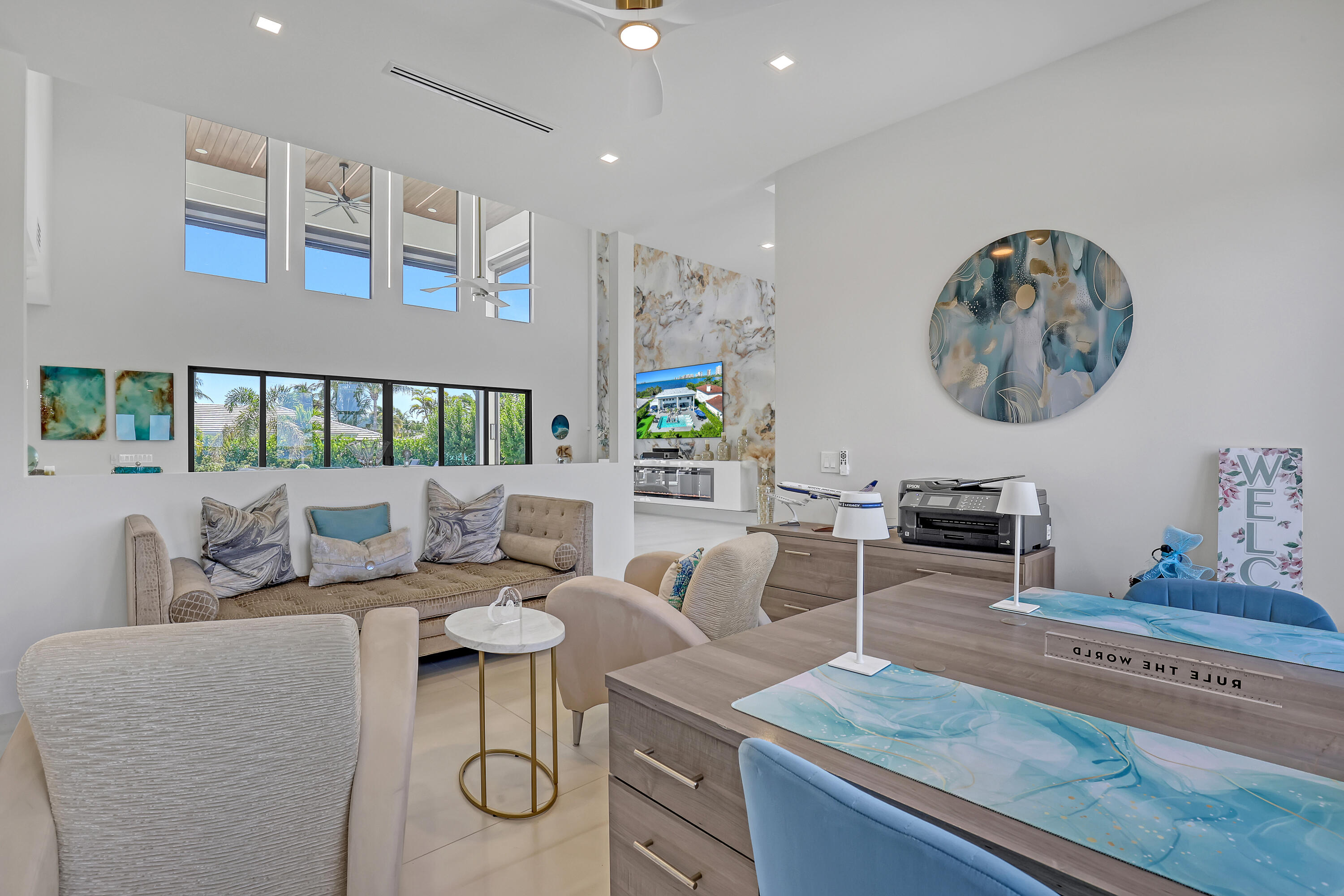 1161 Pine Point Road Riviera Beach, FL 33404 - Photo 15 of 58 a living room with furniture and paintings on the wall