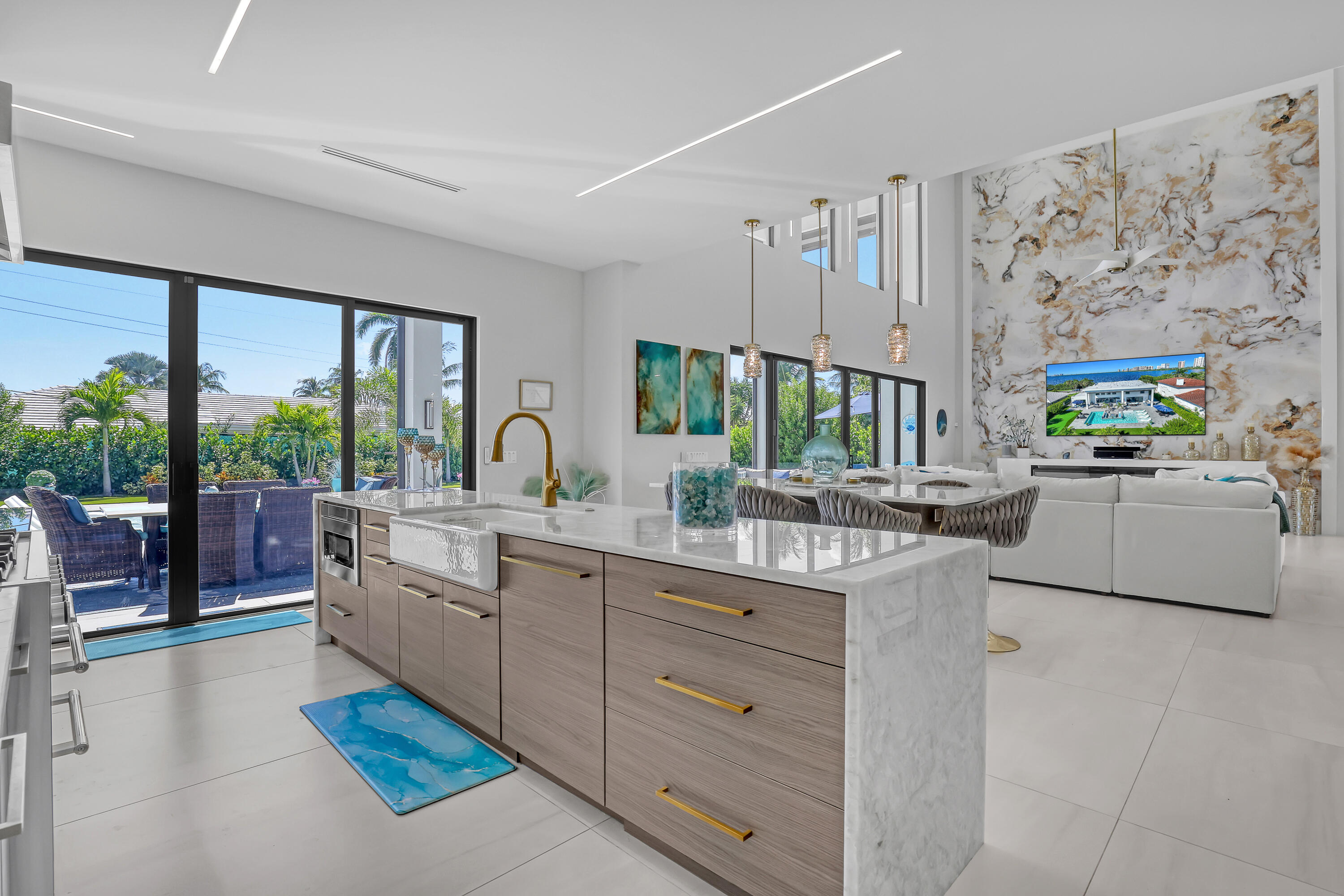 1161 Pine Point Road Riviera Beach, FL 33404 - Photo 19 of 58 a large white kitchen with a large window and sink