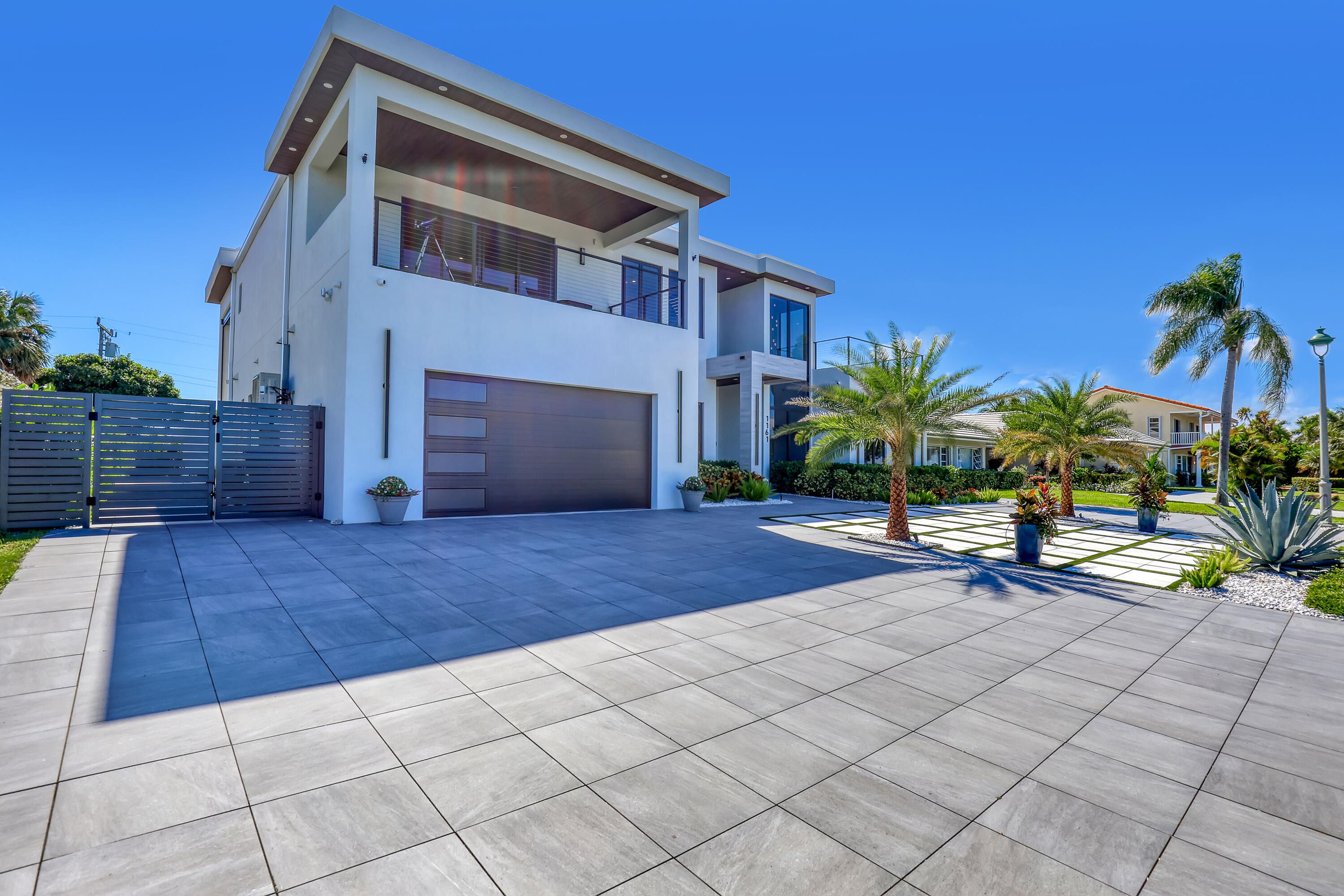 1161 Pine Point Road Riviera Beach, FL 33404 - Photo 2 of 58 a view of house with backyard and sitting area