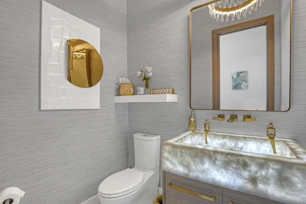 a view of a porch with a dining table and chairs