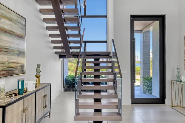 a view of a balcony dining room with furniture