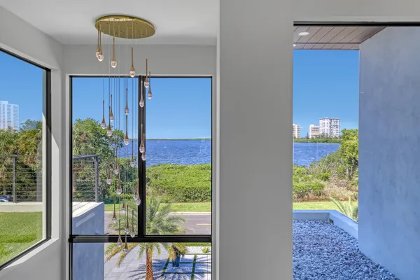 a spacious bedroom with a bed and a large window