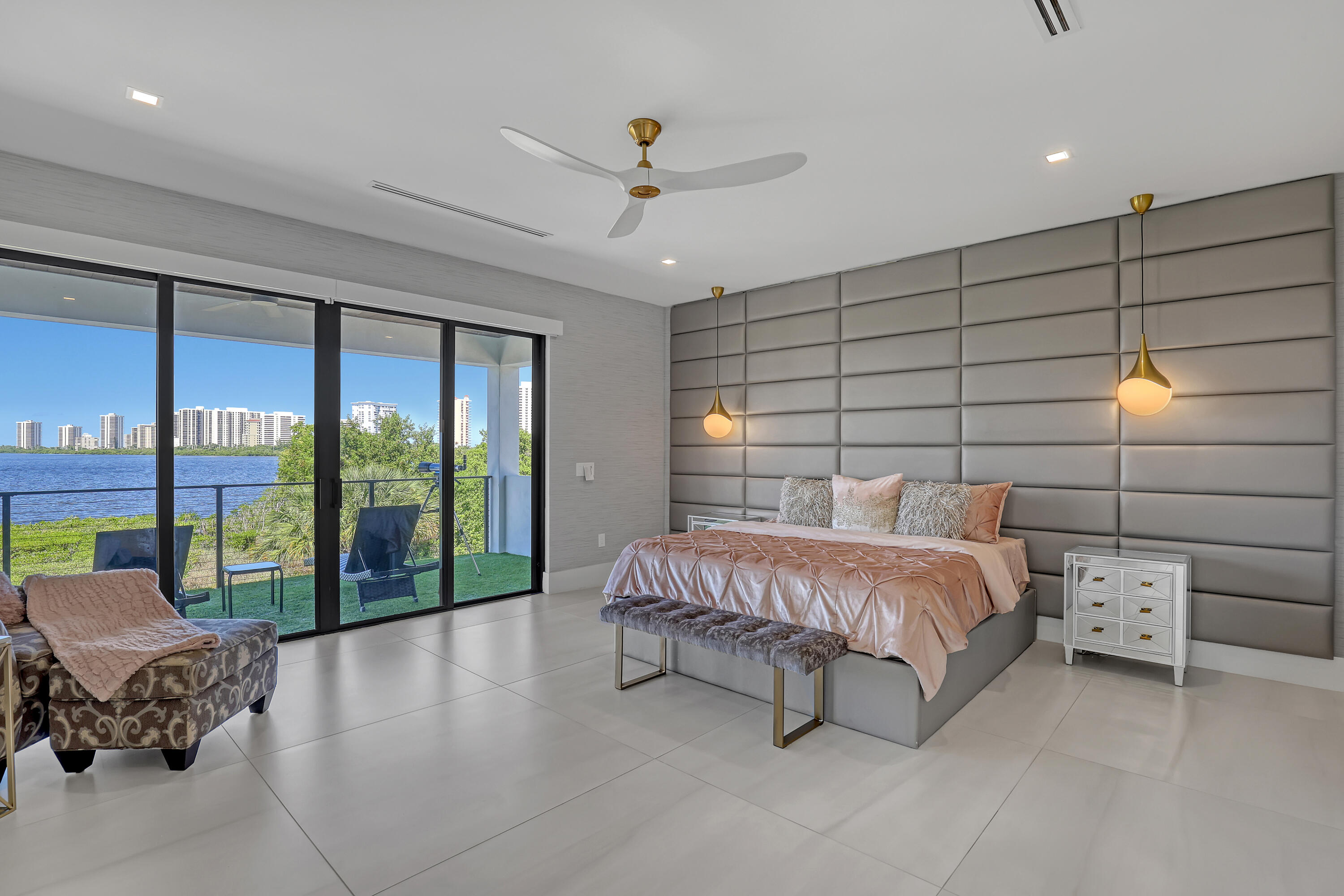1161 Pine Point Road Riviera Beach, FL 33404 - Photo 28 of 58 a spacious bedroom with a bed and a large window
