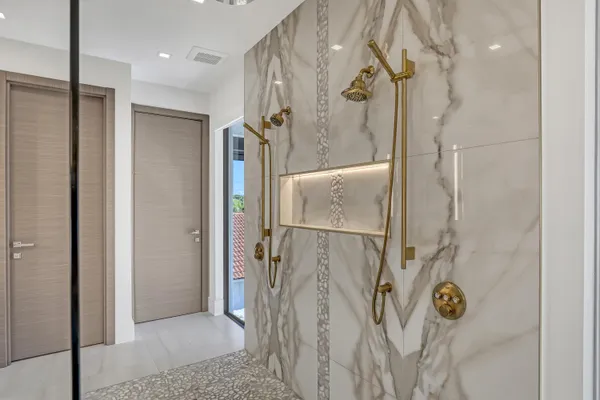 a bathroom with a toilet sink vanity and mirror