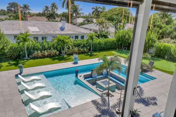 a view of a livingroom with workspace and windows
