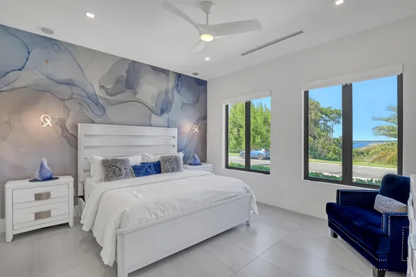 a view of a patio with table and chairs potted plants with outer view