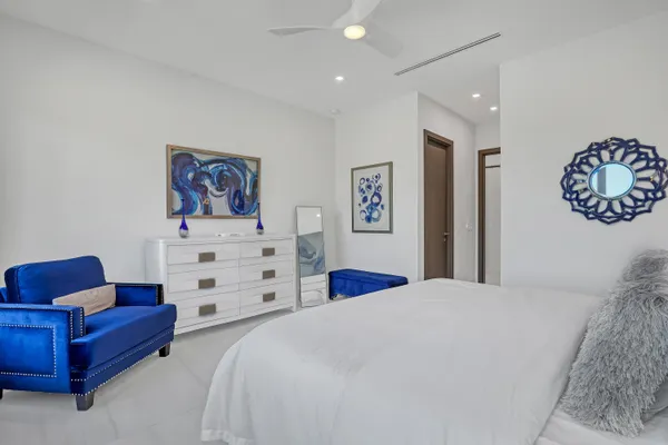 a bedroom with a bed and a couch