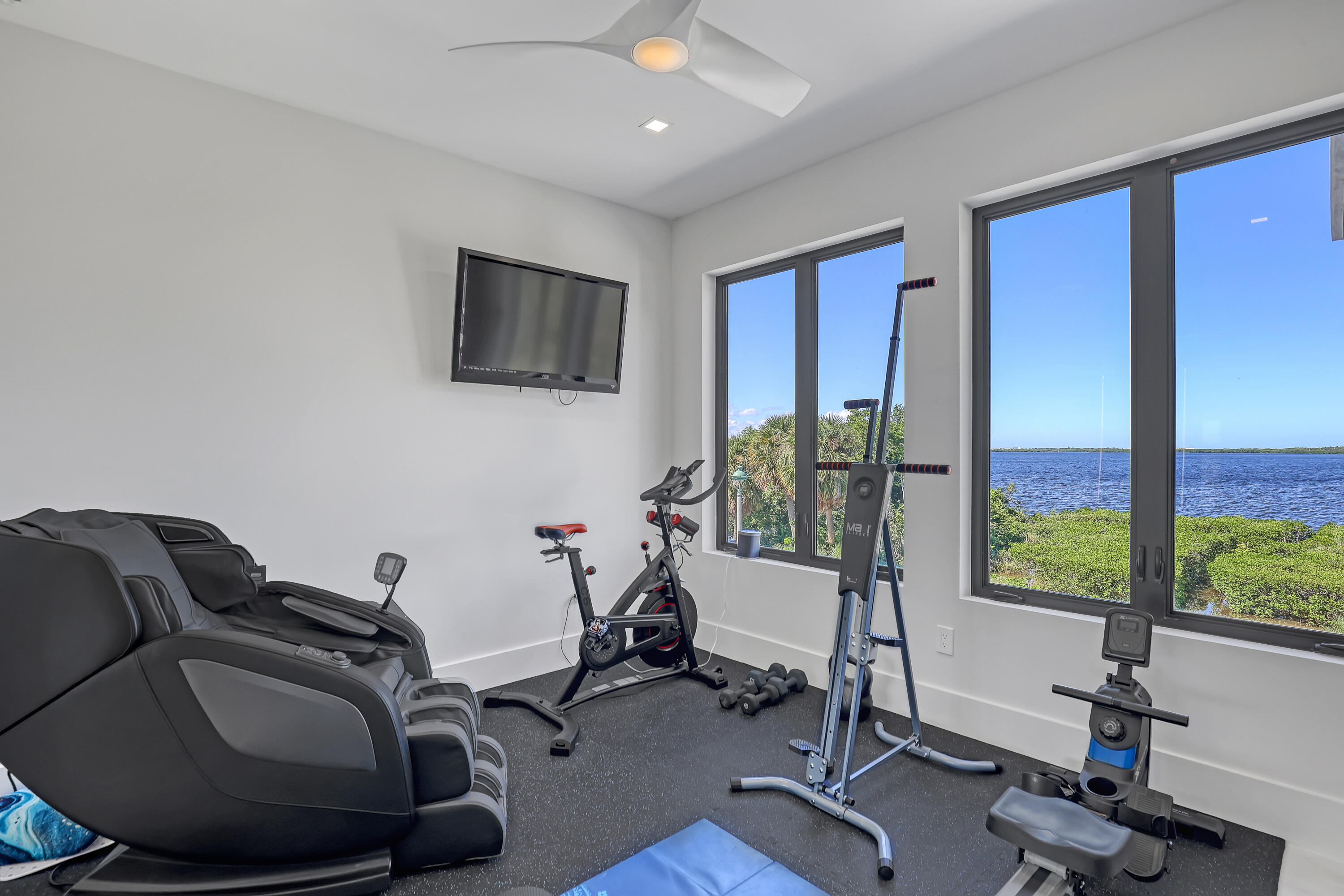 1161 Pine Point Road Riviera Beach, FL 33404 - Photo 40 of 58 a view of a livingroom with workspace and windows