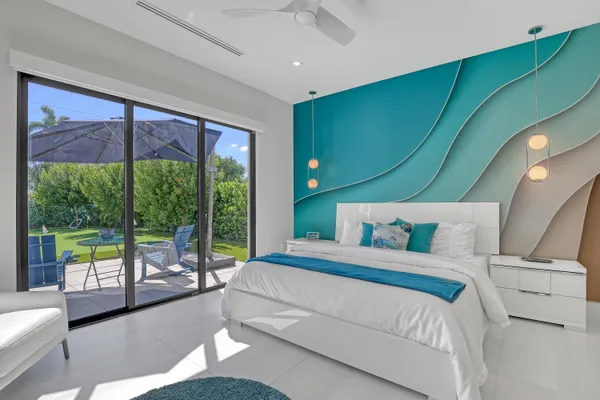 a view of a chairs and table in patio