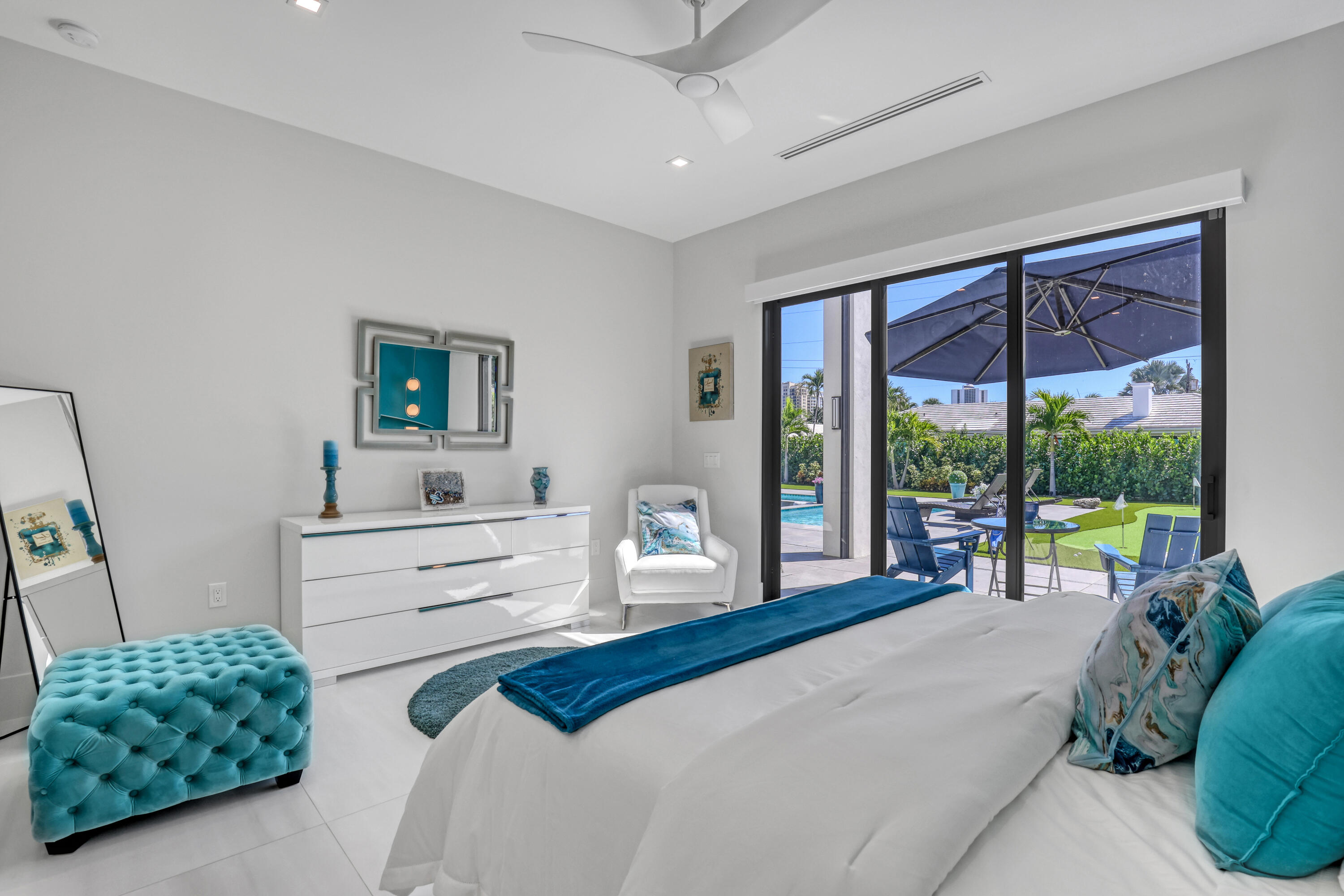 1161 Pine Point Road Riviera Beach, FL 33404 - Photo 42 of 58 a bedroom with a bed and a window