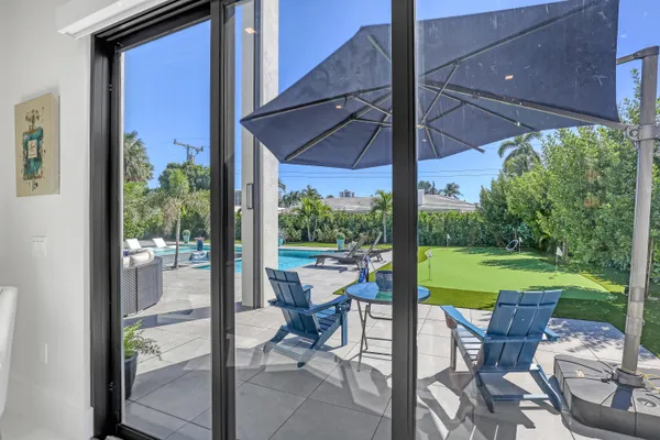 a view of a dining room with furniture window and outdoor view