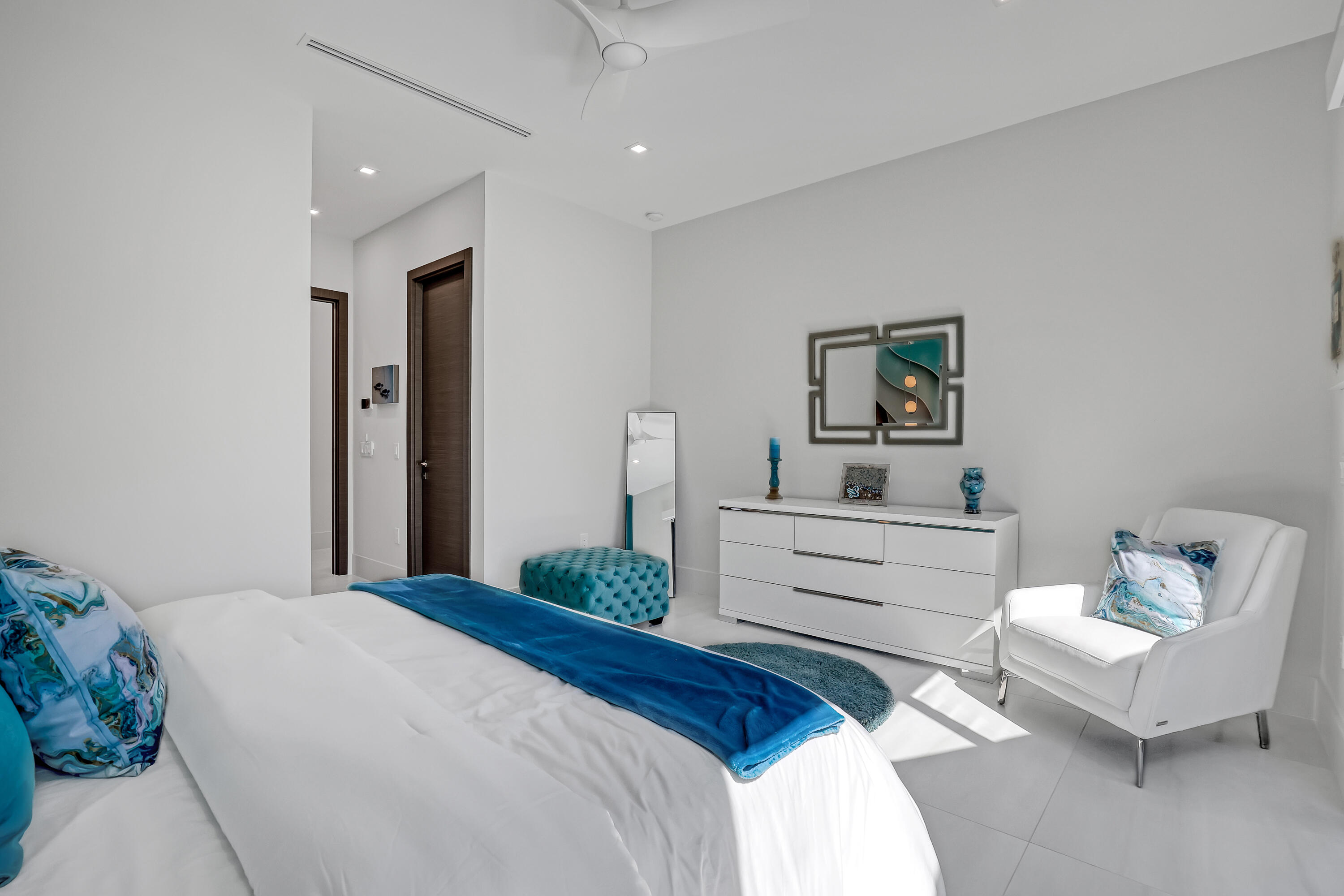 1161 Pine Point Road Riviera Beach, FL 33404 - Photo 44 of 58 a bedroom with a bed and a couch