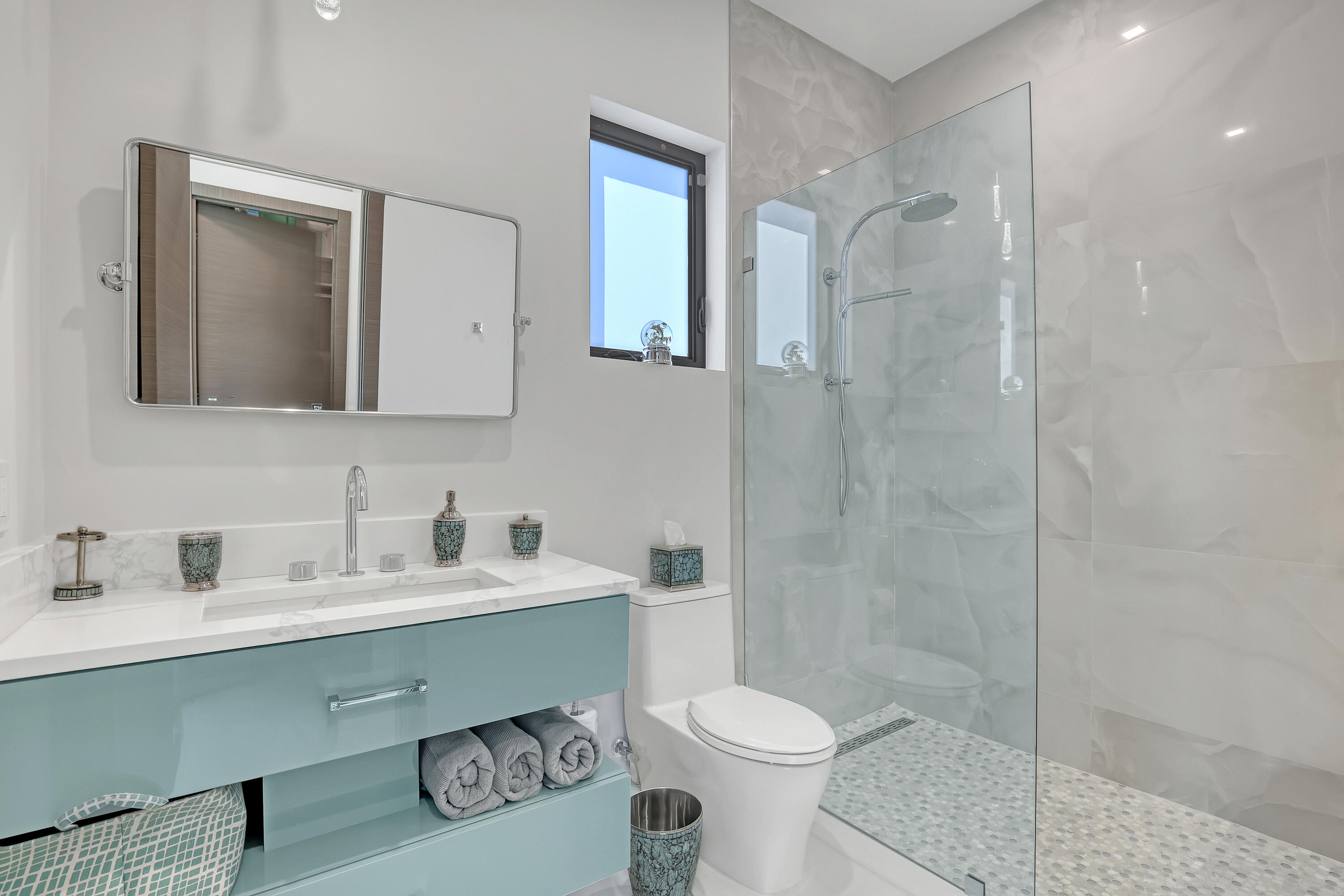 1161 Pine Point Road Riviera Beach, FL 33404 - Photo 45 of 58 a bathroom with a toilet sink and shower