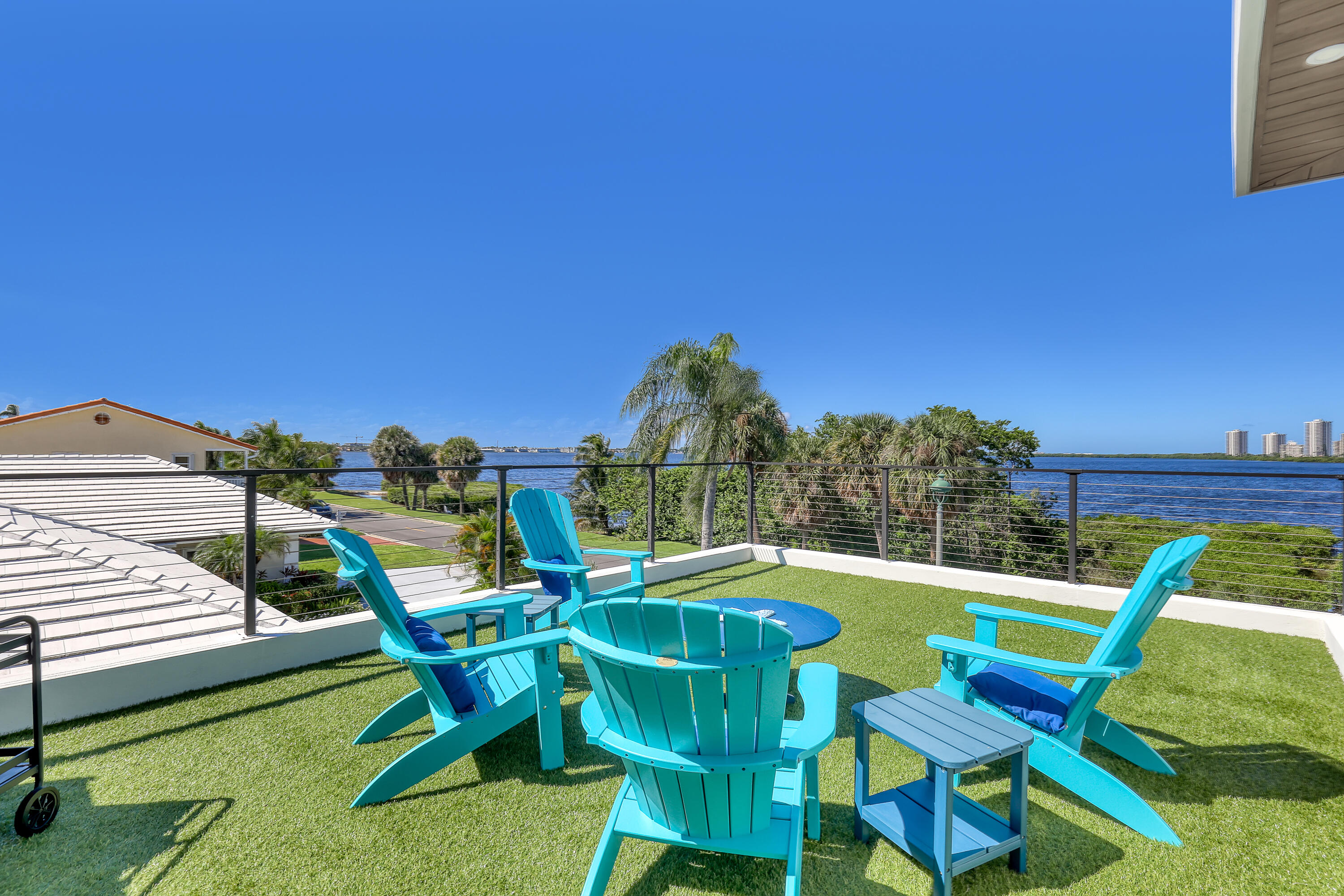 1161 Pine Point Road Riviera Beach, FL 33404 - Photo 47 of 58 a view of a chairs and table in patio