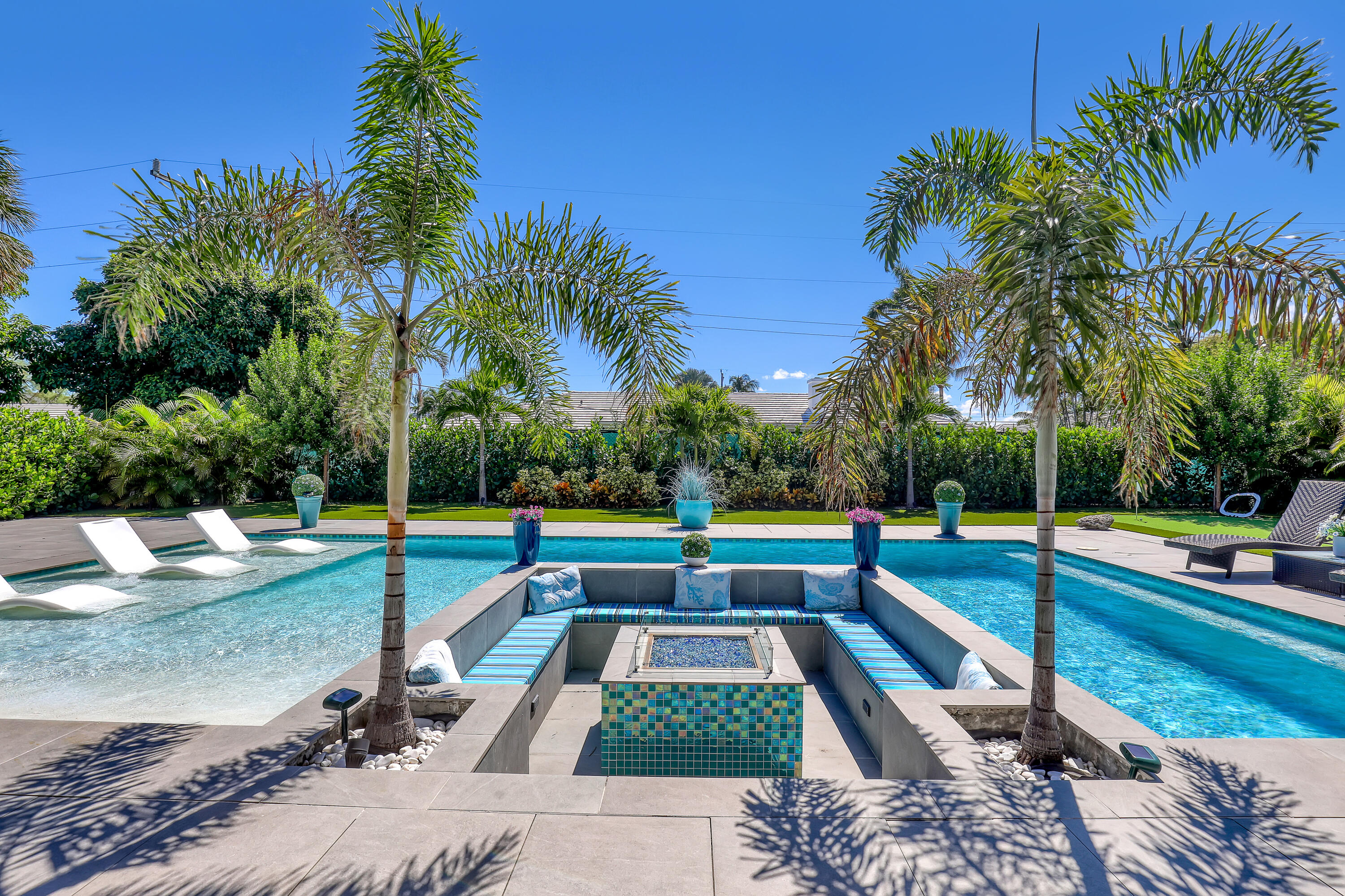 1161 Pine Point Road Riviera Beach, FL 33404 - Photo 49 of 58 a view of swimming pool with chairs
