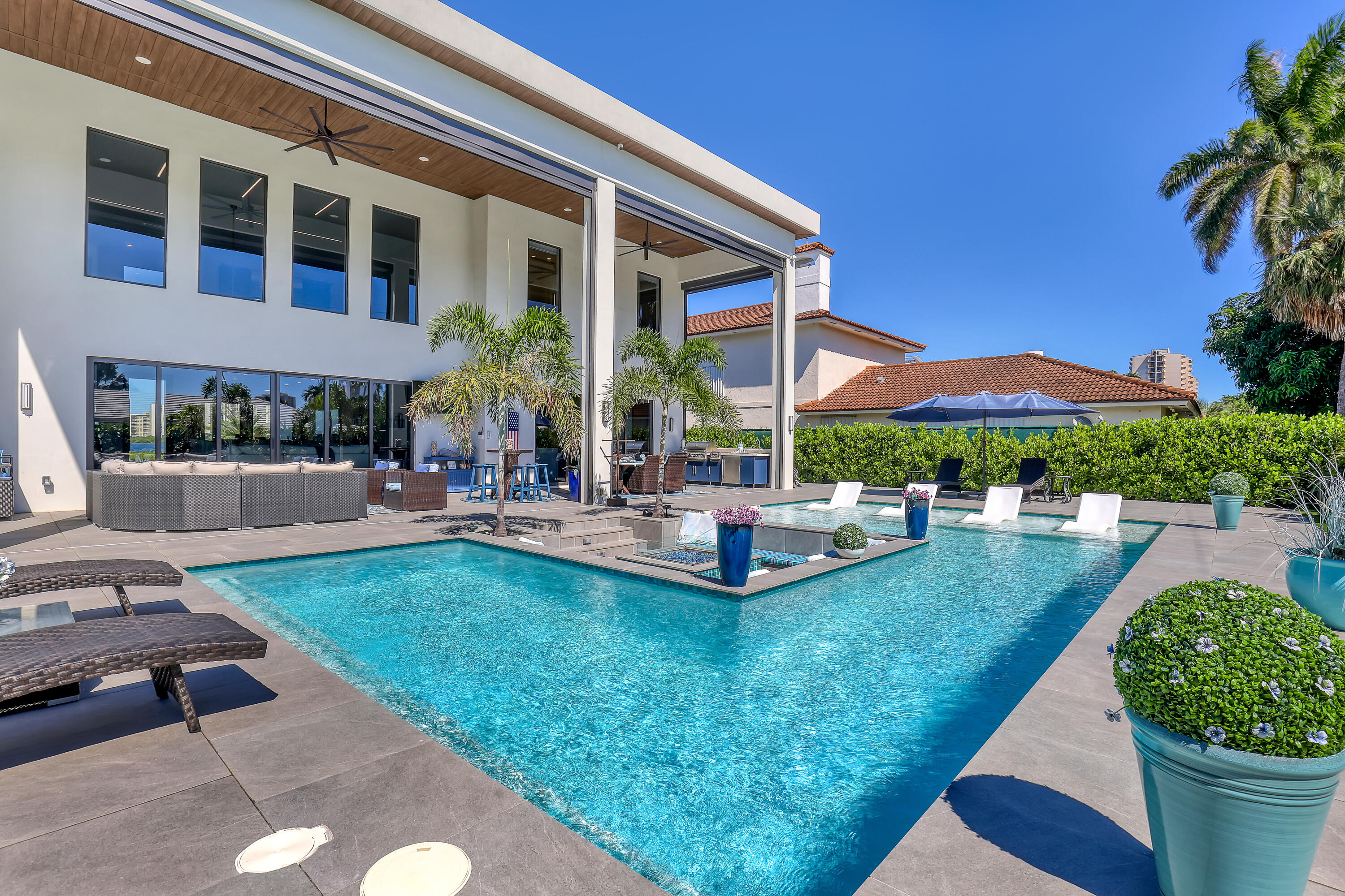 1161 Pine Point Road Riviera Beach, FL 33404 - Photo 52 of 58 a view of swimming pool with outdoor seating and a patio
