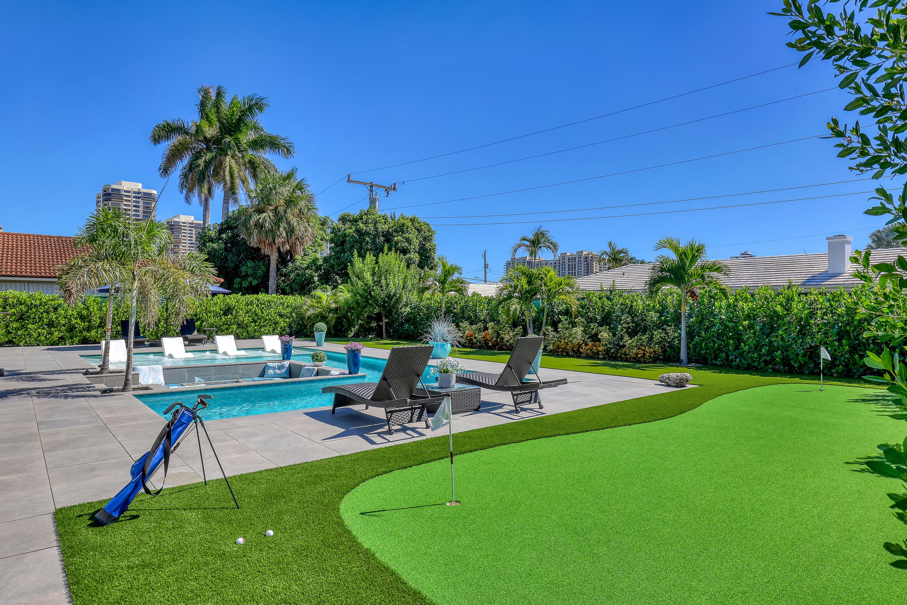 1161 Pine Point Road Riviera Beach, FL 33404 - Photo 56 of 58 a view of a backyard with swimming pool