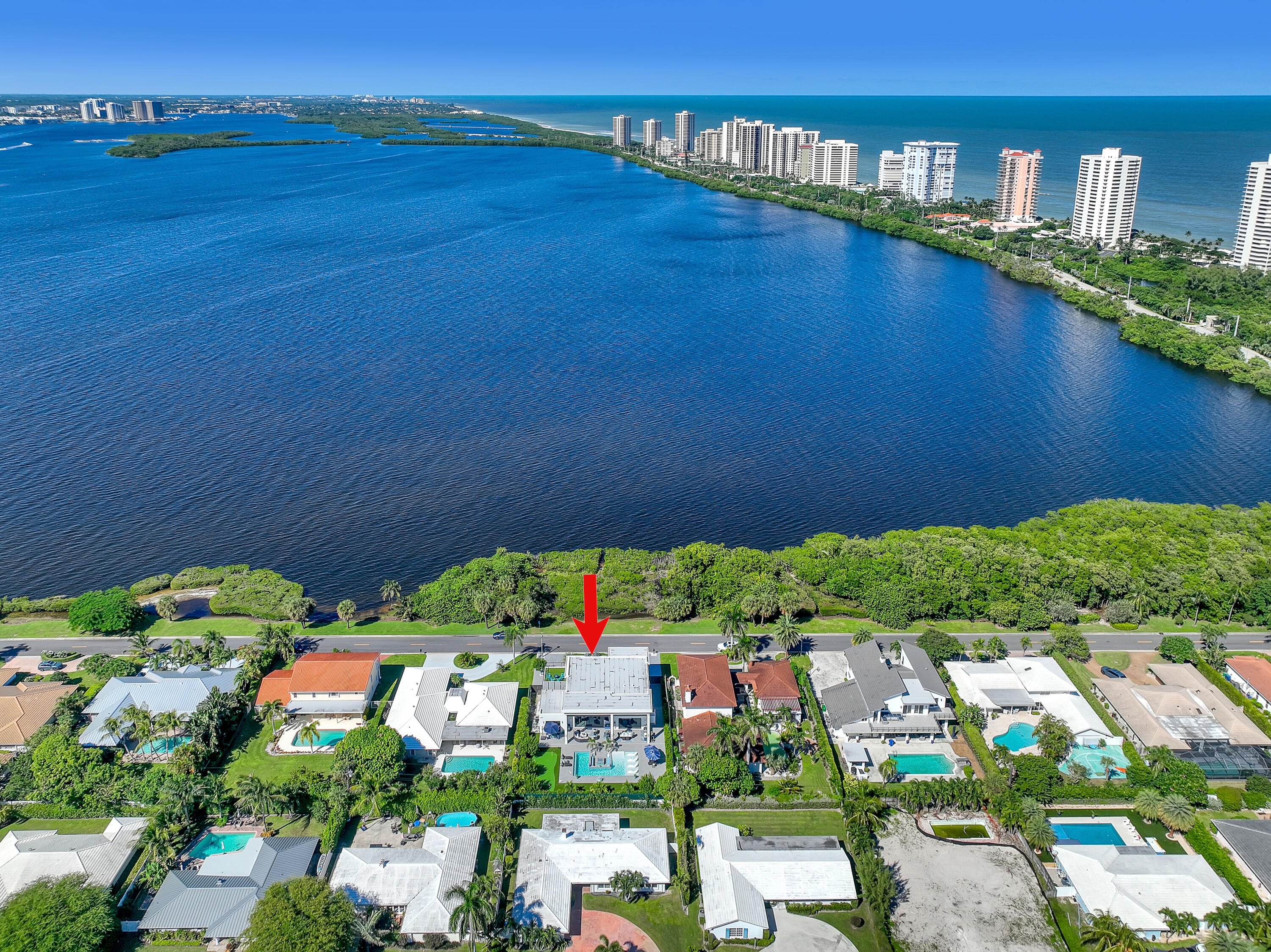 1161 Pine Point Road Riviera Beach, FL 33404 - Photo 58 of 58 a view of a swimming pool with a yard