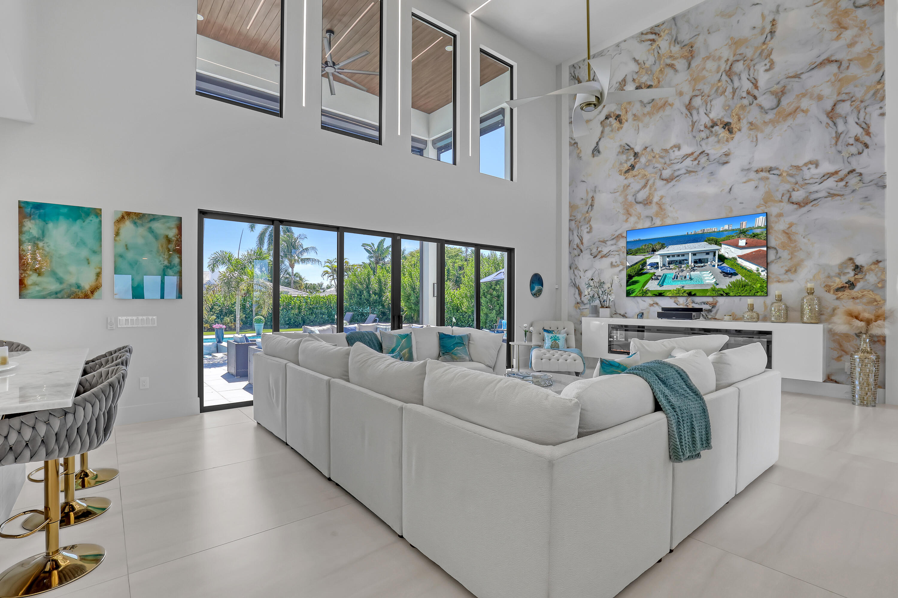 1161 Pine Point Road Riviera Beach, FL 33404 - Photo 10 of 58 a living room with furniture and a floor to ceiling window