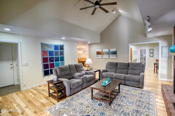 a living room with furniture and a rug