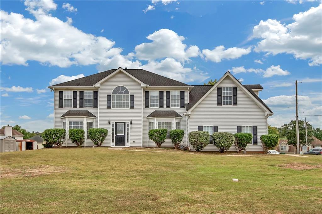 2337 Bankside Circle Decatur, GA 30035 - Photo 1 of 1 a front view of a house with garden