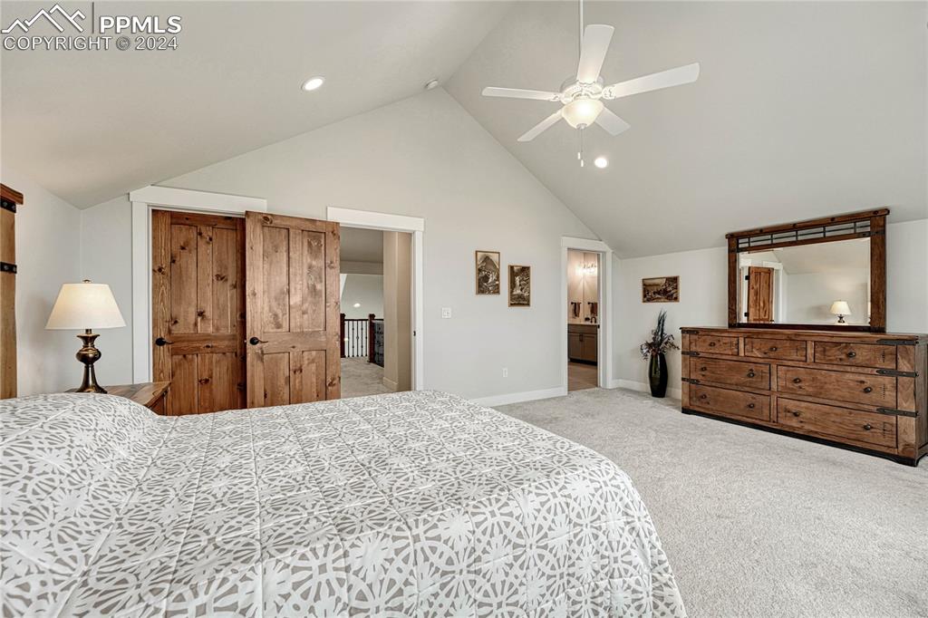 1183 2nd Street Penrose, CO 81240 - Photo 41 of 50 a large bedroom with a bed and a chandelier