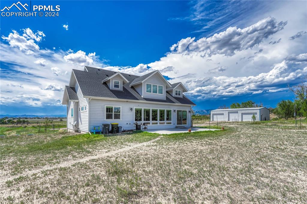 1183 2nd Street Penrose, CO 81240 - Photo 46 of 50 a view of a house with a big yard and large trees