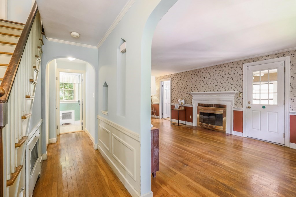 30 St Elmo Road Worcester, MA 01602 - Photo 16 of 42 a view of a livingroom with wooden floor and a fireplace