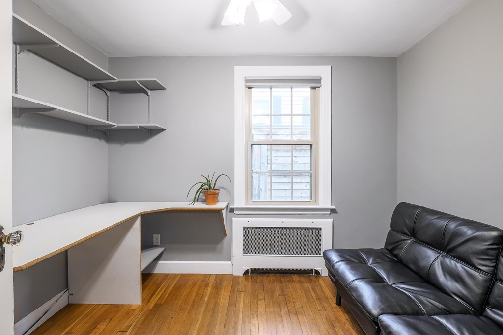 30 St Elmo Road Worcester, MA 01602 - Photo 20 of 42 a living room with furniture and a wooden floor