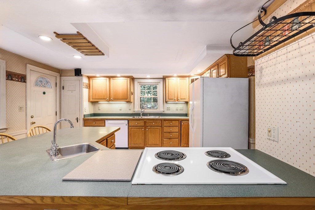 30 St Elmo Road Worcester, MA 01602 - Photo 24 of 42 a kitchen with a stove a refrigerator and a sink
