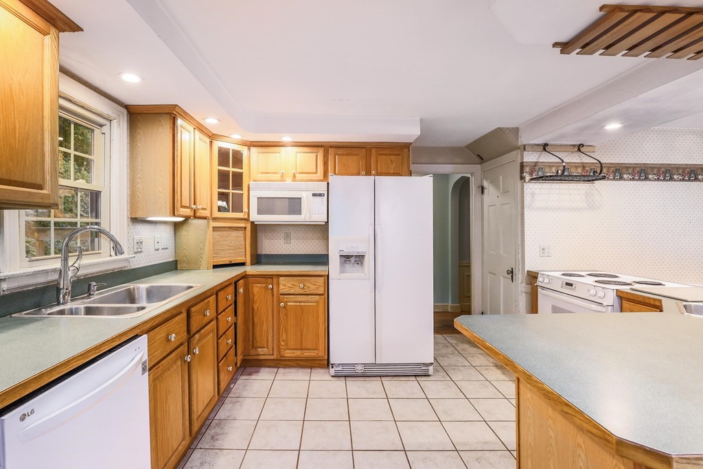 30 St Elmo Road Worcester, MA 01602 - Photo 26 of 42 a kitchen with stainless steel appliances granite countertop a sink and a refrigerator