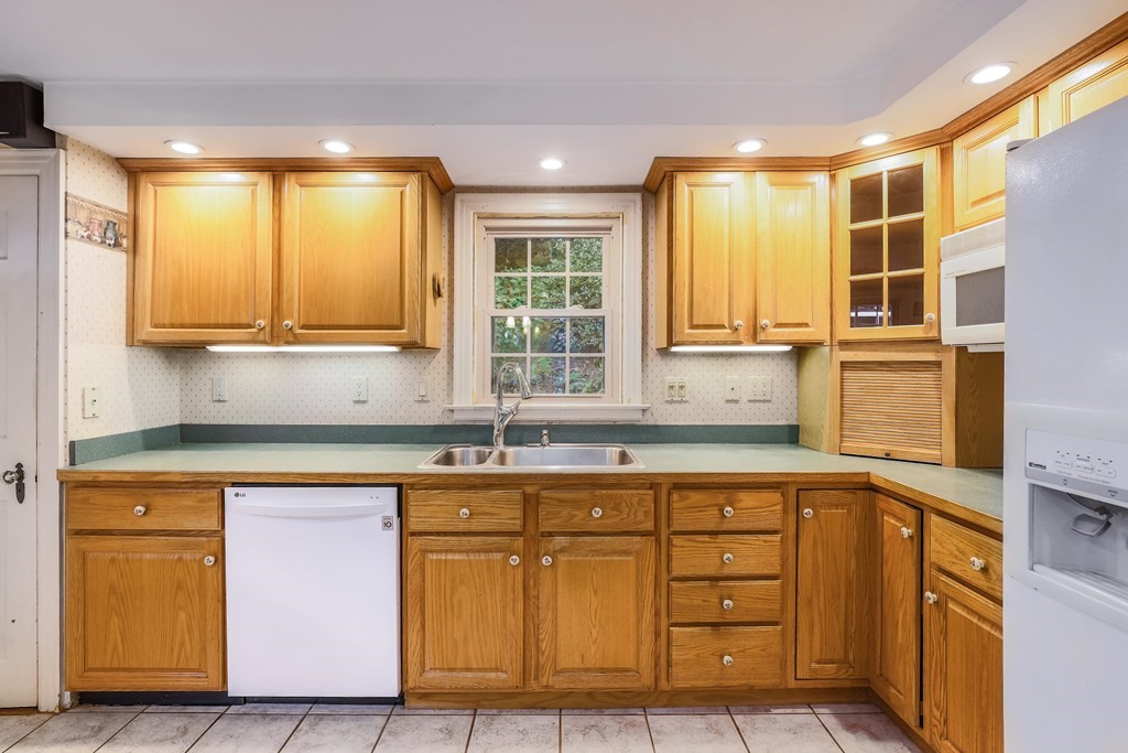 30 St Elmo Road Worcester, MA 01602 - Photo 28 of 42 a kitchen with granite countertop cabinets and window