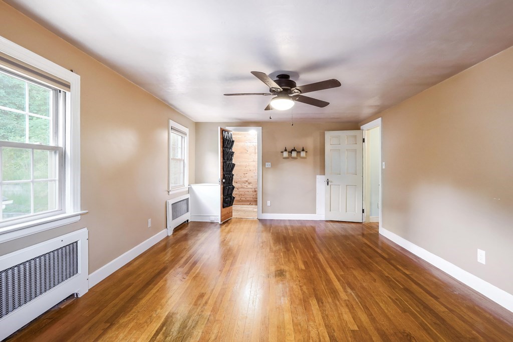 30 St Elmo Road Worcester, MA 01602 - Photo 32 of 42 a view of an empty room with wooden floor and a window