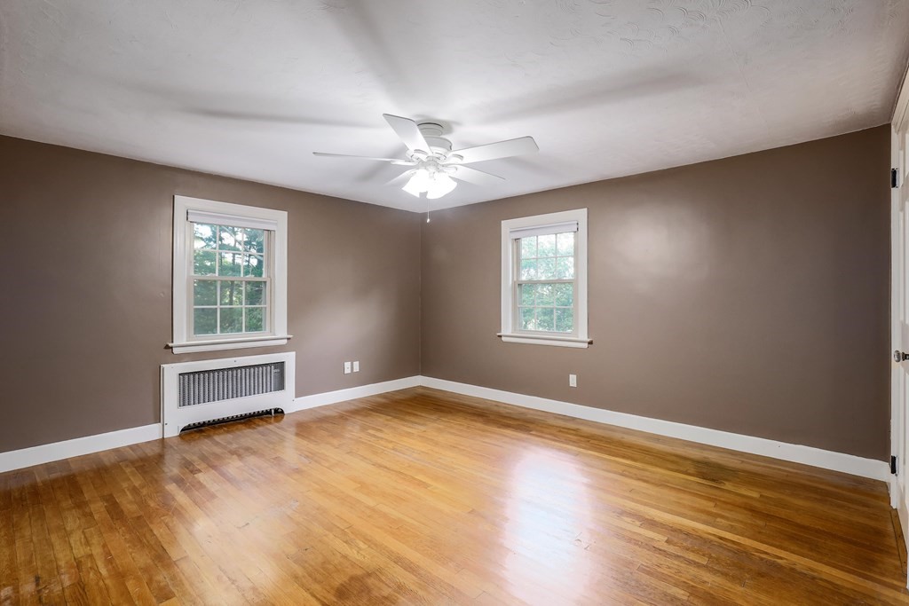 30 St Elmo Road Worcester, MA 01602 - Photo 38 of 42 a view of an empty room with a window and wooden floor