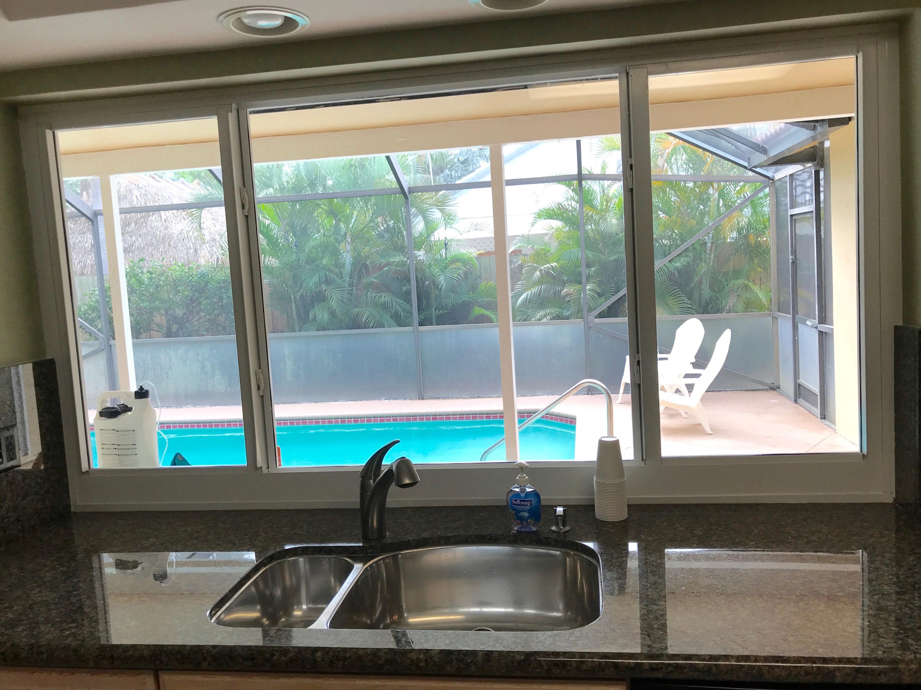 1630 Northwest 7th Street Boca Raton, FL 33486 - Photo 8 of 27 KITCHEN POOL VIEW