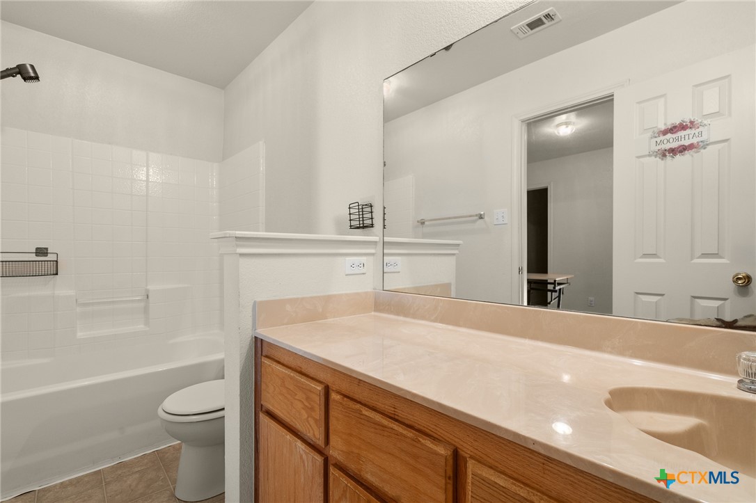 1103 Katelyn Circle Copperas Cove, TX 76522 - Photo 15 of 16 a bathroom with a sink a toilet and shower