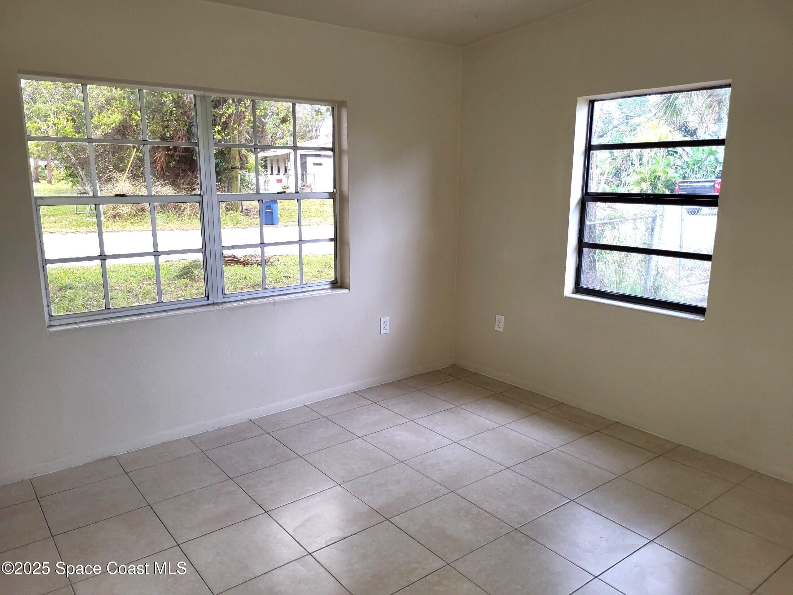2351 Shenandoah Road Palm Bay, FL 32905 - Photo 15 of 28 an empty room with windows