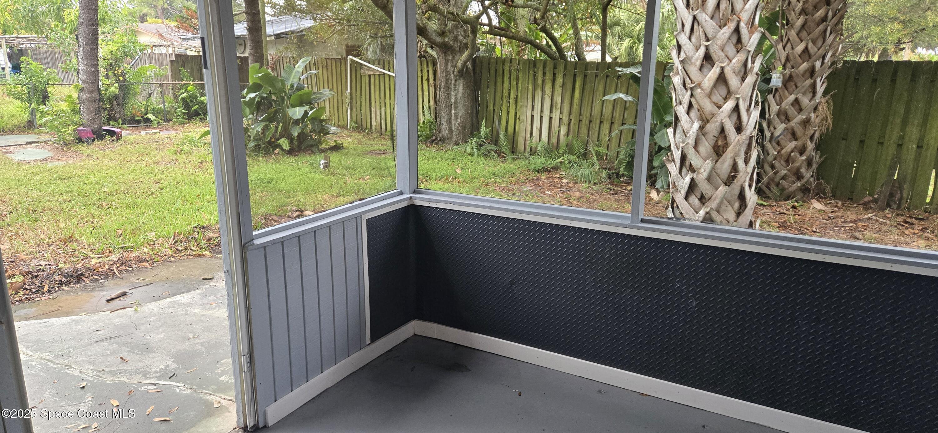2351 Shenandoah Road Palm Bay, FL 32905 - Photo 20 of 28 a view of a porch with a yard