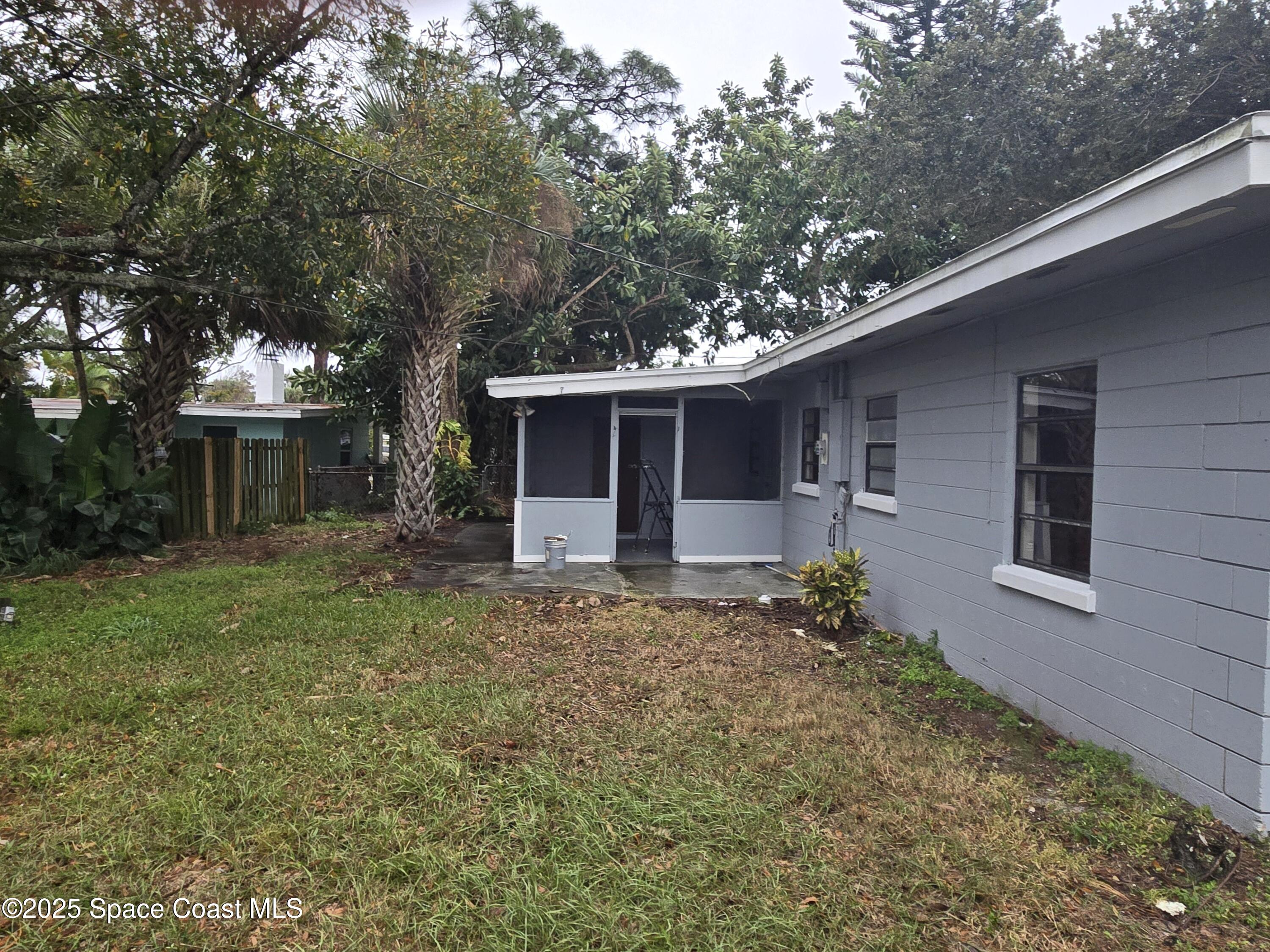 2351 Shenandoah Road Palm Bay, FL 32905 - Photo 24 of 28 a view of a house with a yard