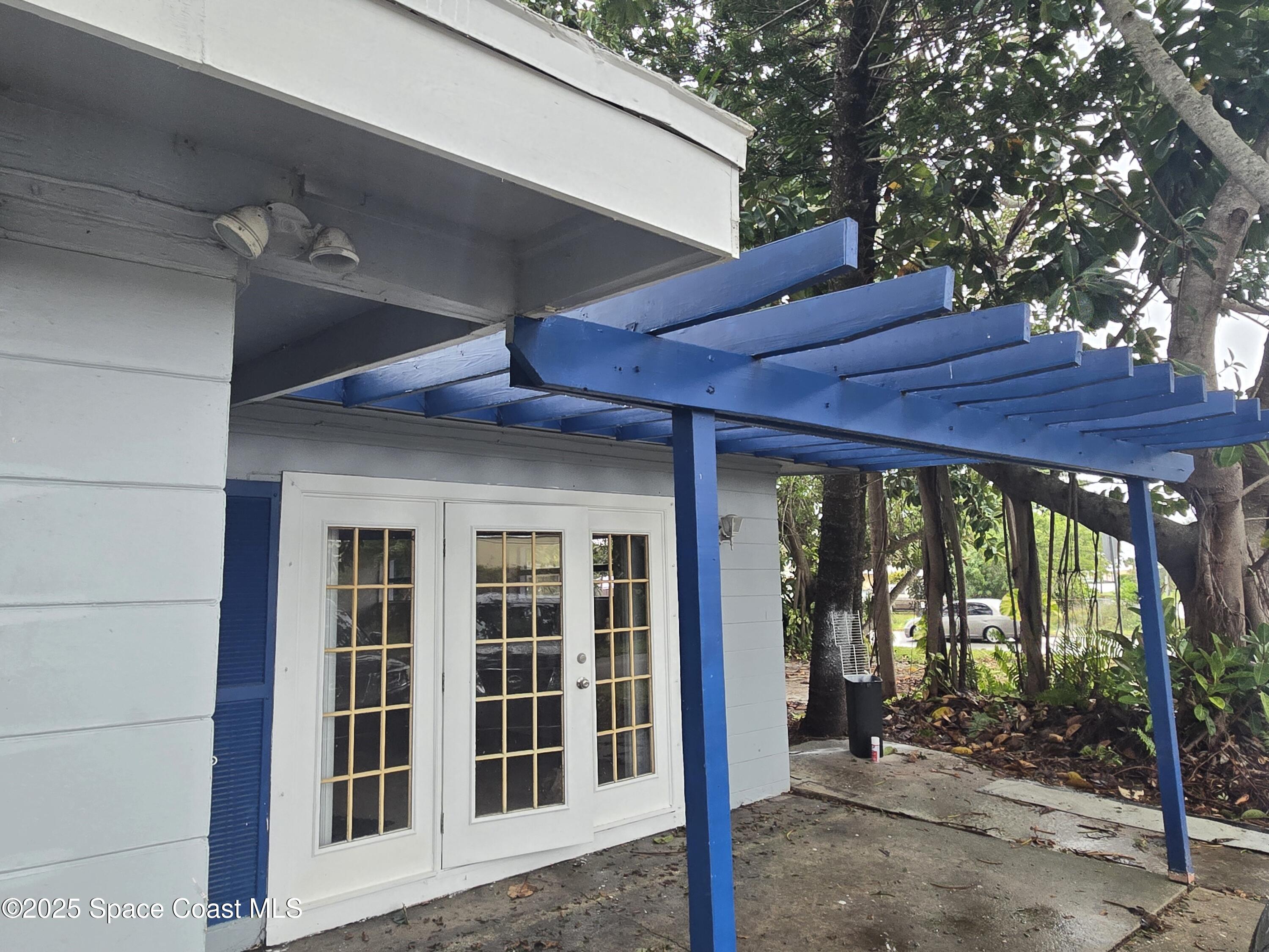 2351 Shenandoah Road Palm Bay, FL 32905 - Photo 4 of 28 a view of a house with a large window