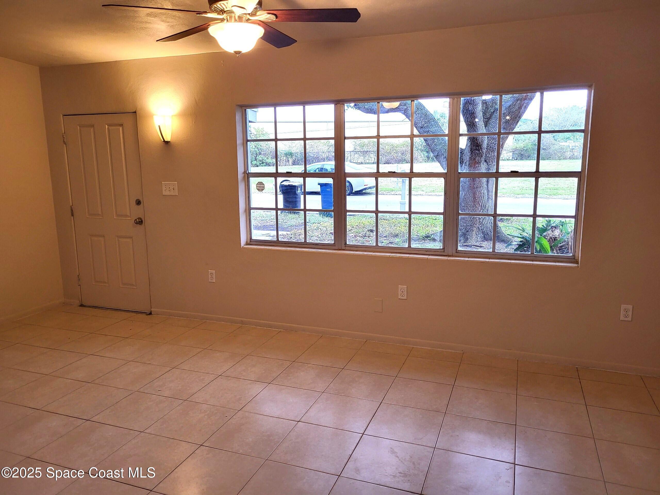 2351 Shenandoah Road Palm Bay, FL 32905 - Photo 6 of 28 a view of an empty room with a window