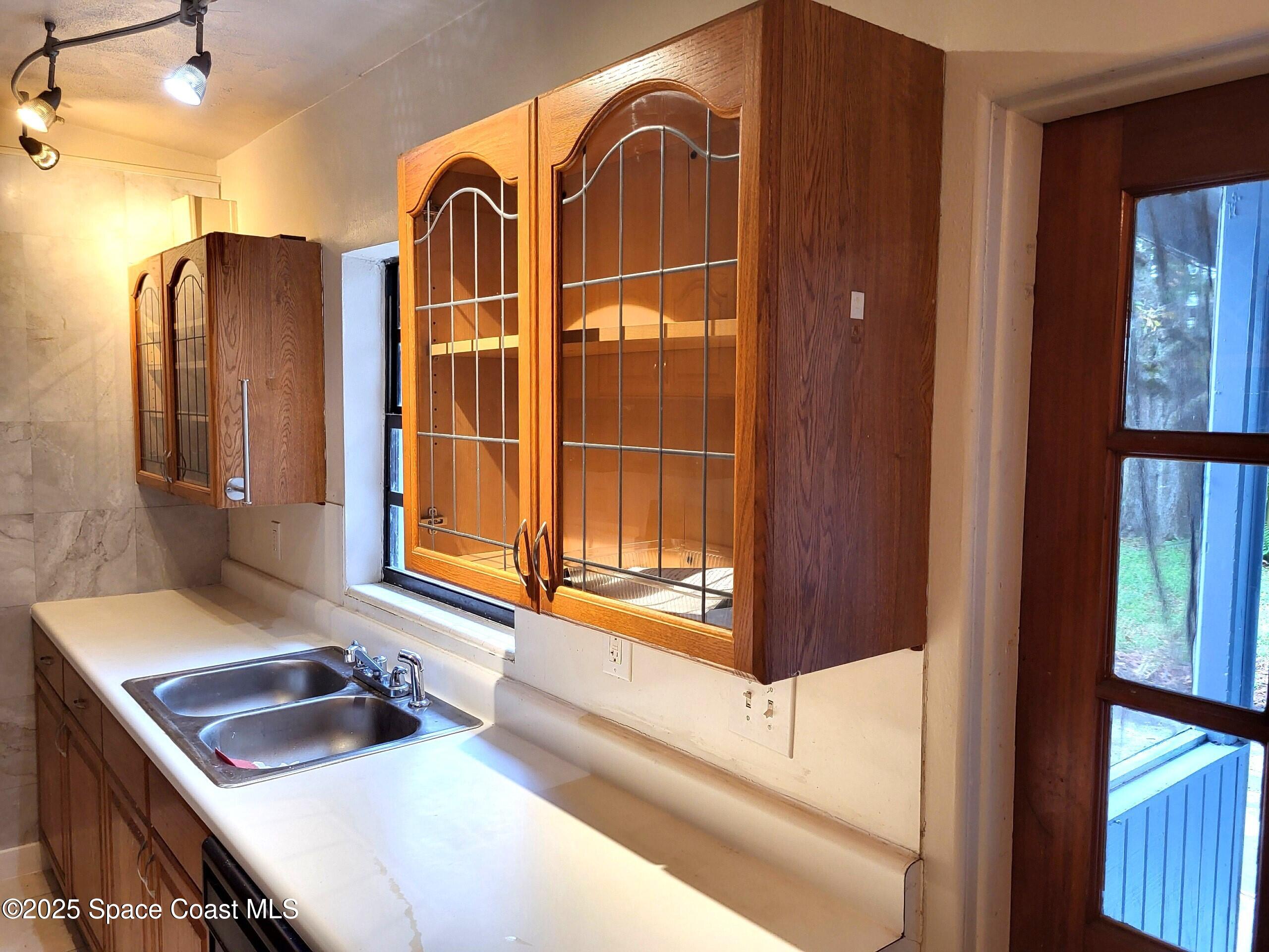 2351 Shenandoah Road Palm Bay, FL 32905 - Photo 8 of 28 a bathroom with a sink and a mirror