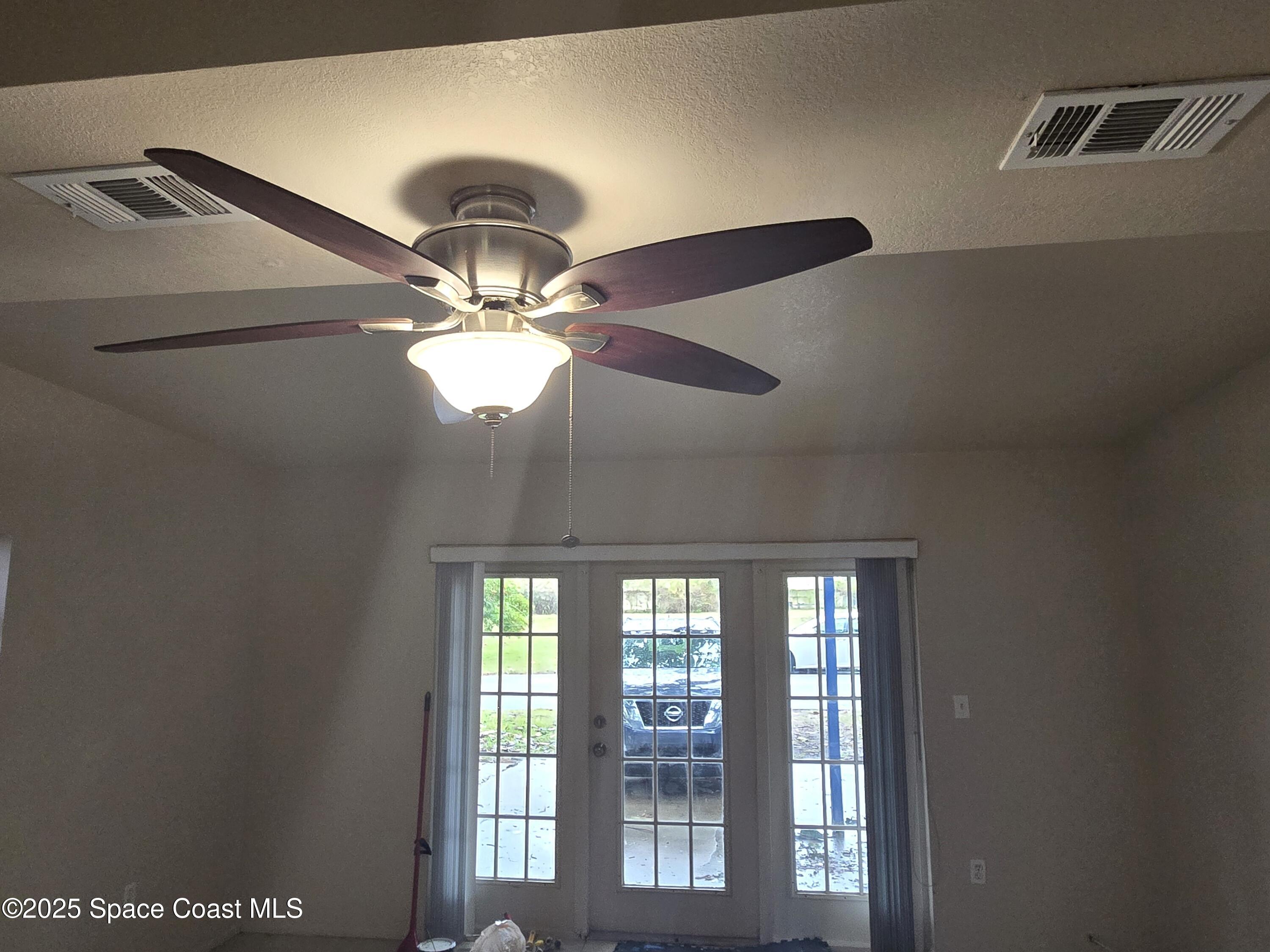 2351 Shenandoah Road Palm Bay, FL 32905 - Photo 9 of 28 a light fixture a ceiling fan and window