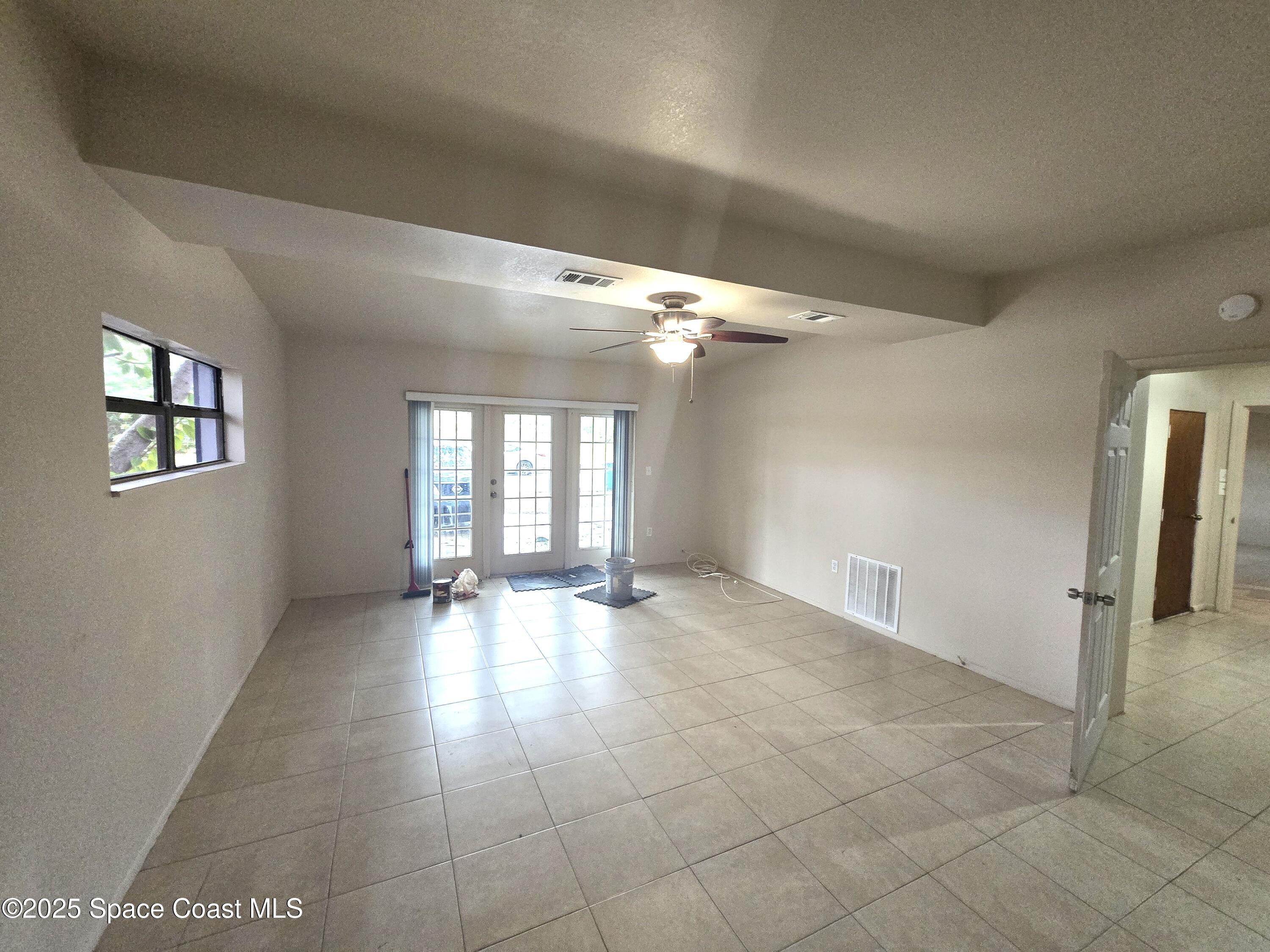 2351 Shenandoah Road Palm Bay, FL 32905 - Photo 10 of 28 a view of an empty room with a window