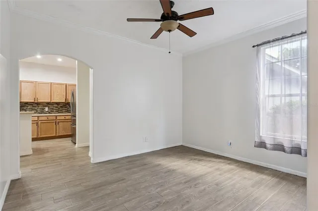 a view of a kitchen with a sink and dishwasher a refrigerator with wooden floor