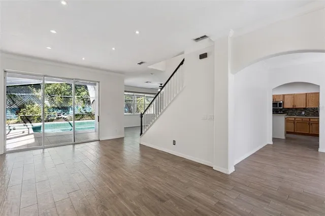 a view of kitchen with furniture and wooden floor