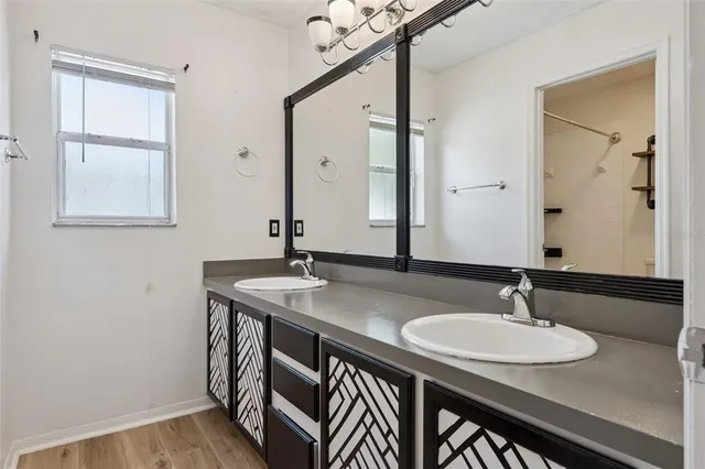 a bathroom with a sink and a mirror