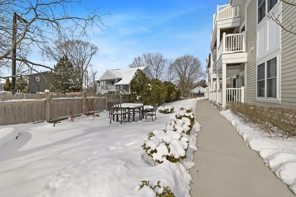 a view of a terrace with snow on the road